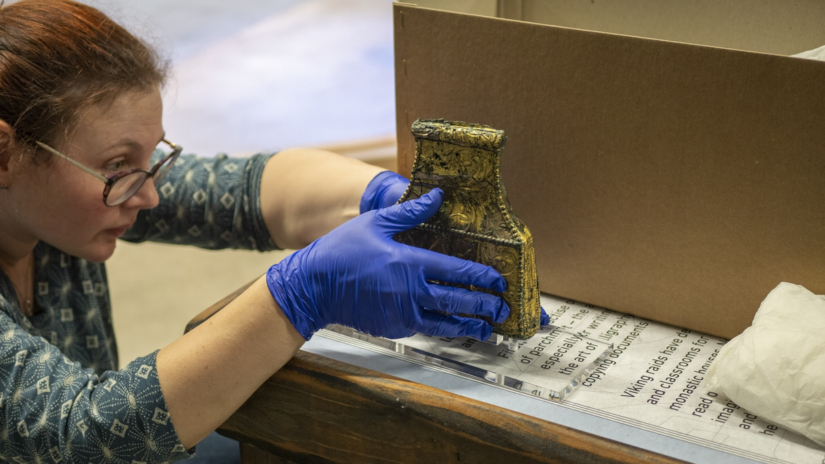 A member of our Collections team handling the Winchester Reliquary