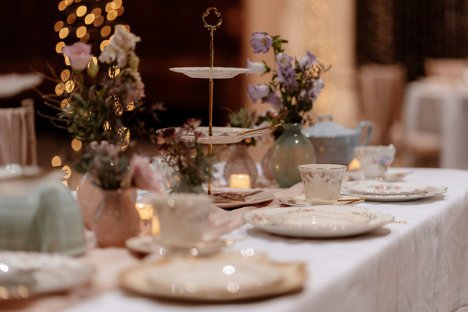 Colourful plates and flowers adorn a table