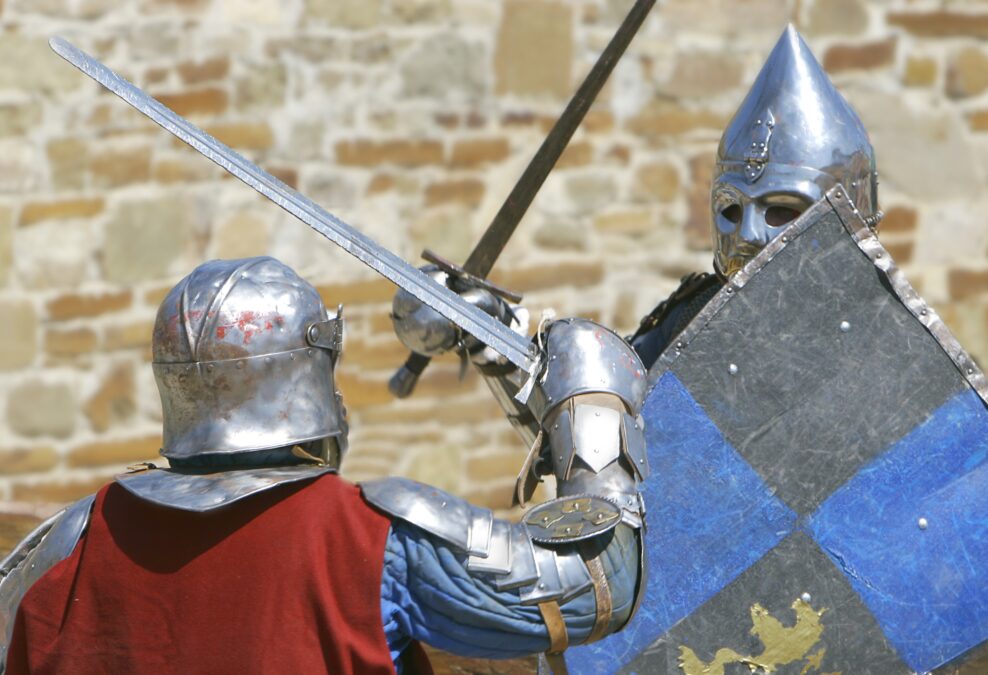 Knights in armour fighting with swords