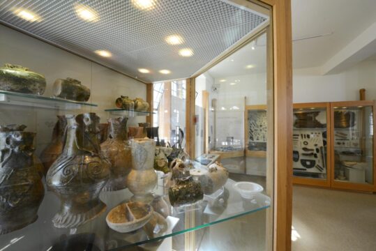 Display case in Winchester City Museum featuring Anglo-Saxon pots.