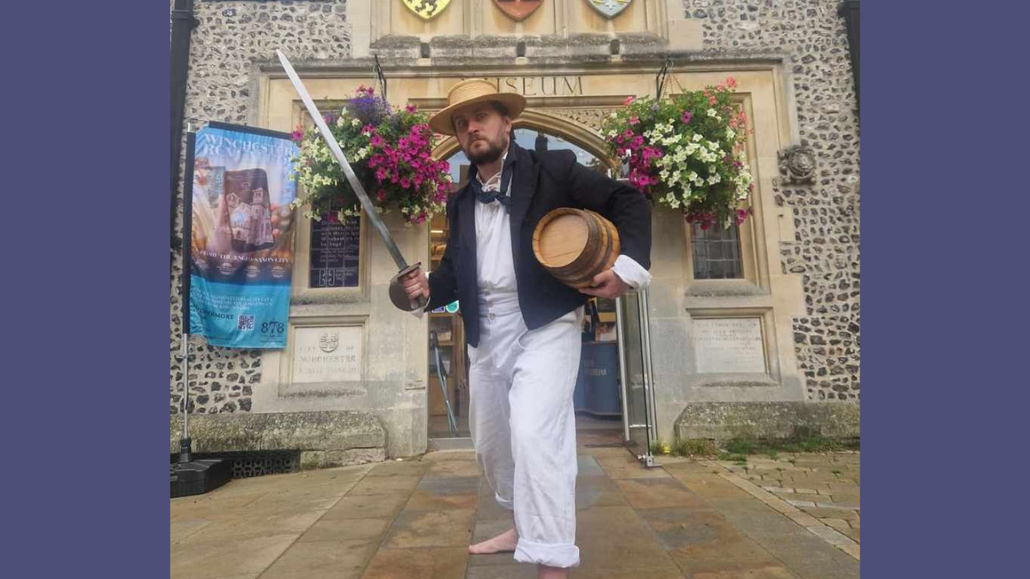 A menacing sailor brandishing a sword in front of the museum